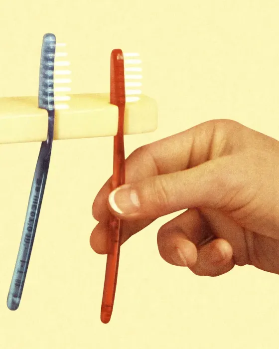 Framed Print : Hand and Two Toothbrushes Framed Print : Hand and Two Toothbrushes