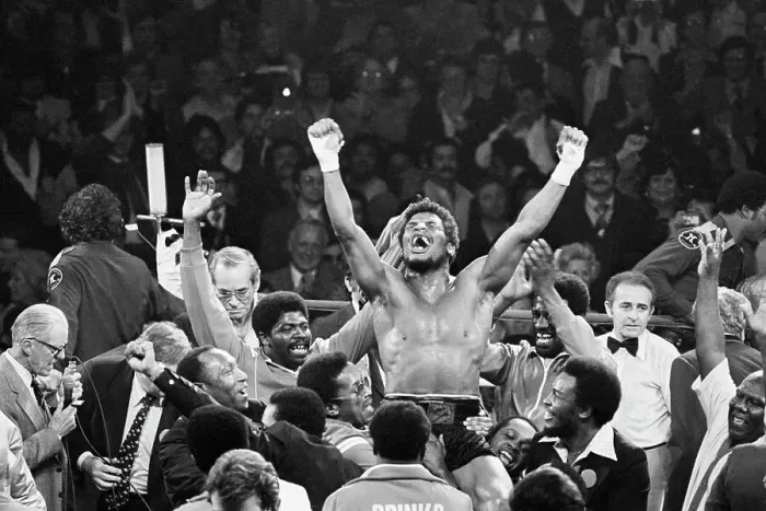 Framed Print : Handlers Raising Leon Spinks On Shoulders Framed Print : Handlers Raising Leon Spinks On Shoulders