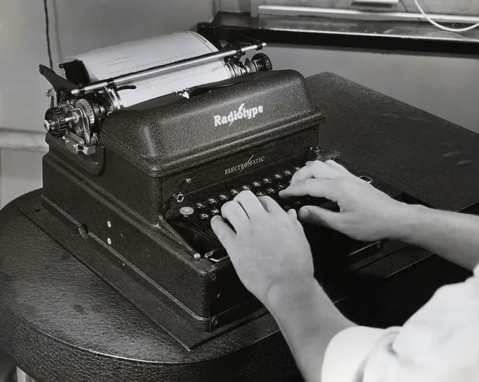 Framed Print : Hands Operating An Ibm Radiotype Machine