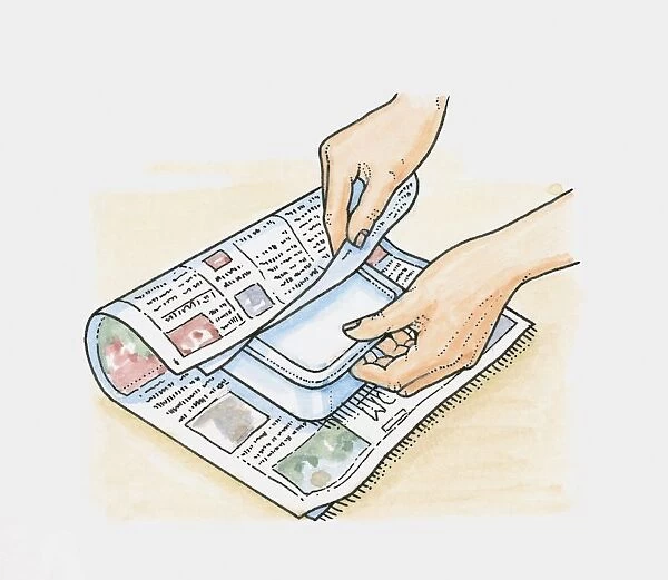 Hands wrapping frozen food in newspapers to keep it cool