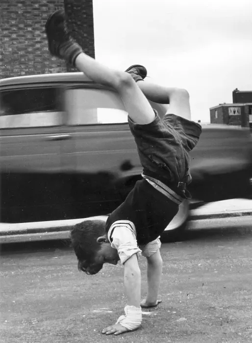 Framed Print : Handstand. A little boy doing a handstand in the road Framed Print : Handstand. A little boy doing a handstand in the road