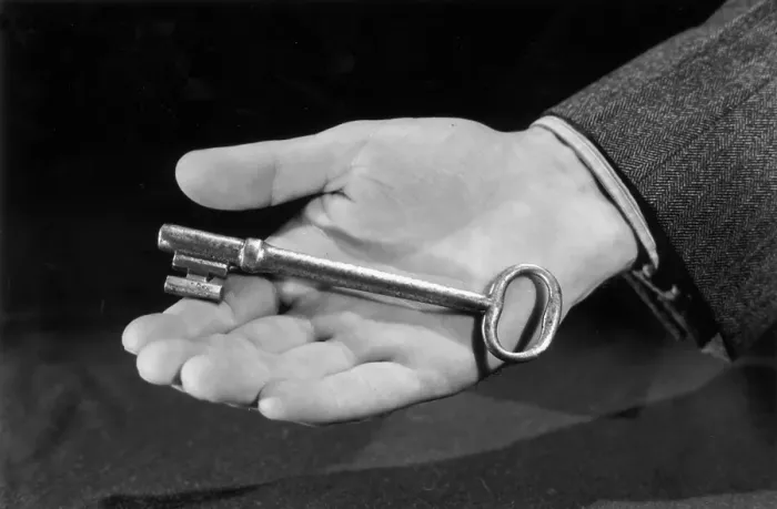 Framed Print : Handy Key. circa 1945: Closeup of a man's hand holding a large key Framed Print : Handy Key. circa 1945: Closeup of a man's hand holding a large key