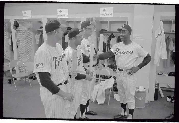 Framed Print : Hank Aaron Checking Players Bats for Readiness Framed Print : Hank Aaron Checking Players Bats for Readiness