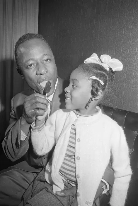 Framed Print : Hank Aaron Licking Lollipop with Young Girl Framed Print : Hank Aaron Licking Lollipop with Young Girl