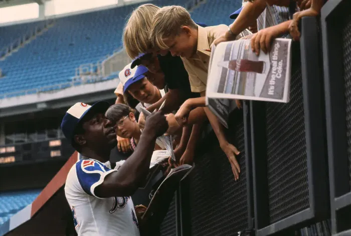 Framed Print : Hank Aaron Signing Autographs for Children in Stadium Framed Print : Hank Aaron Signing Autographs for Children in Stadium