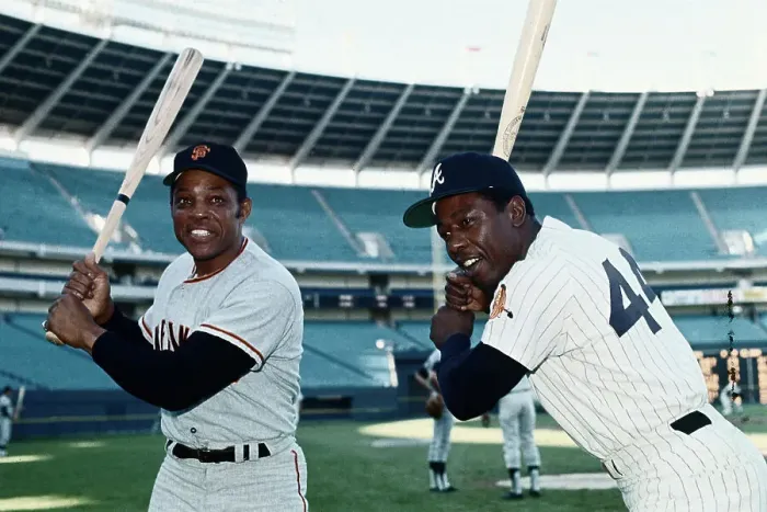 Framed Print : Hank Aaron and Willie Mays Holding Baseball Bats