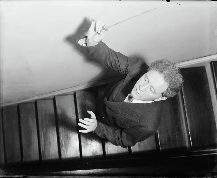 Framed Print : Hans Kindler Posing on Stairs with Baton