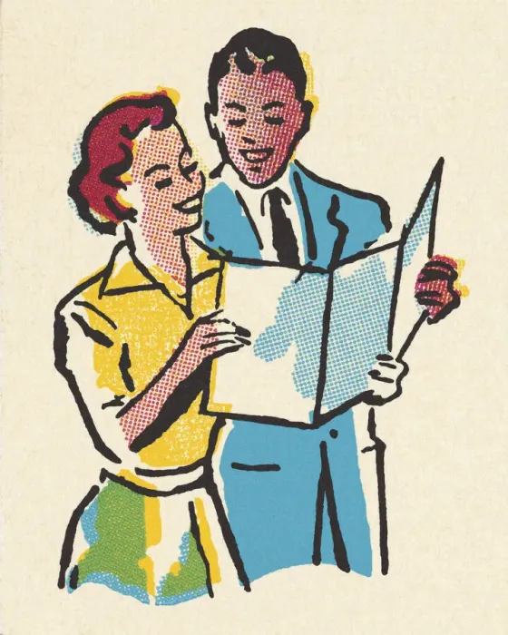Framed Print : Happy Couple Looking at a Paper Framed Print : Happy Couple Looking at a Paper