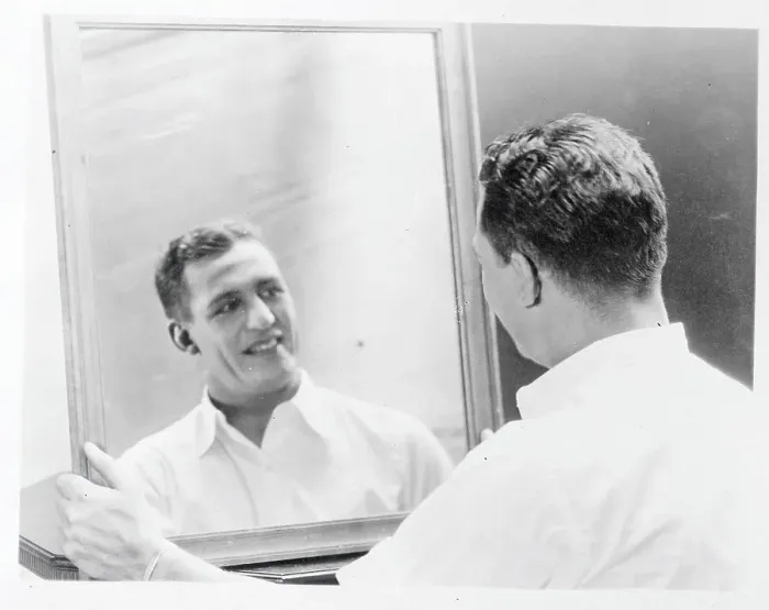 Framed Print : Harold Grange Looks in Mirror After Applying Makeup Framed Print : Harold Grange Looks in Mirror After Applying Makeup