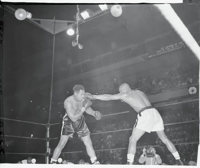 Framed Print : Harold Johnson Punching Archie Moore Framed Print : Harold Johnson Punching Archie Moore