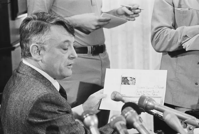 Framed Print : Harold Rhoden Holding up Document and Speaking Framed Print : Harold Rhoden Holding up Document and Speaking