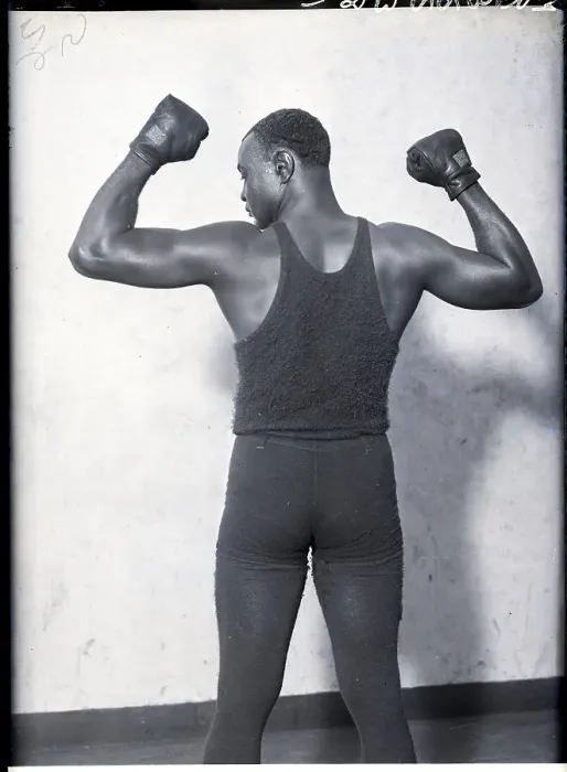 Framed Print : Harry Wills Flexes to Show Muscular Back Framed Print : Harry Wills Flexes to Show Muscular Back