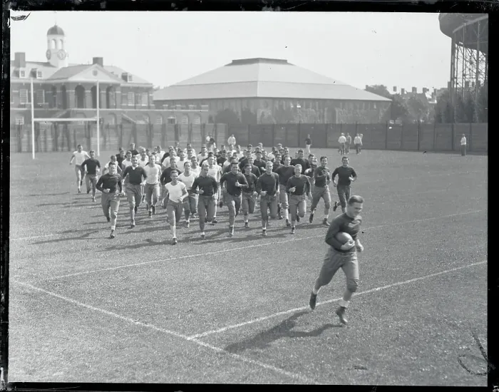 Framed Print : Harvard Teammates Jogging on Field Framed Print : Harvard Teammates Jogging on Field