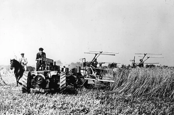 Harvester. September 1907: Mechanical reapers working in a field