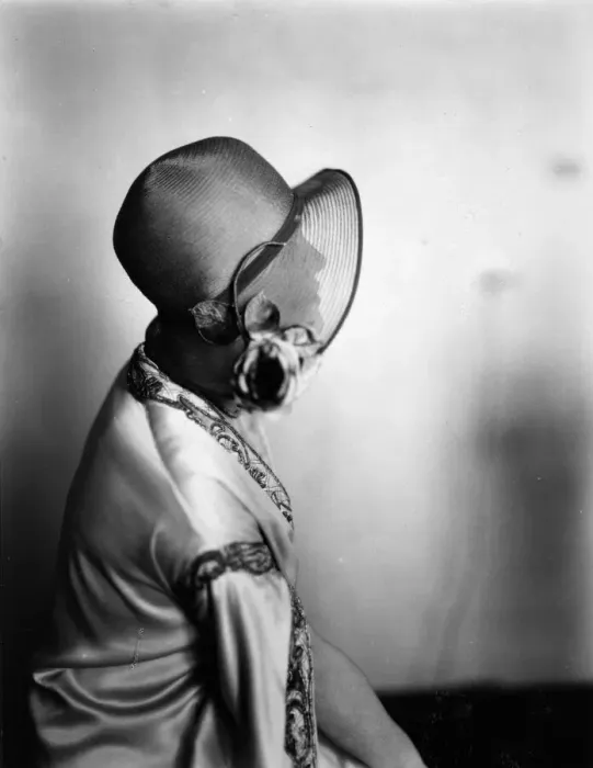 Framed Print : Hat Brim. circa 1928: A woman is silhouetted by her hat brim Framed Print : Hat Brim. circa 1928: A woman is silhouetted by her hat brim