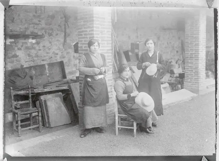 Framed Print : Hat Makers Working Outside in Front of Building Framed Print : Hat Makers Working Outside in Front of Building