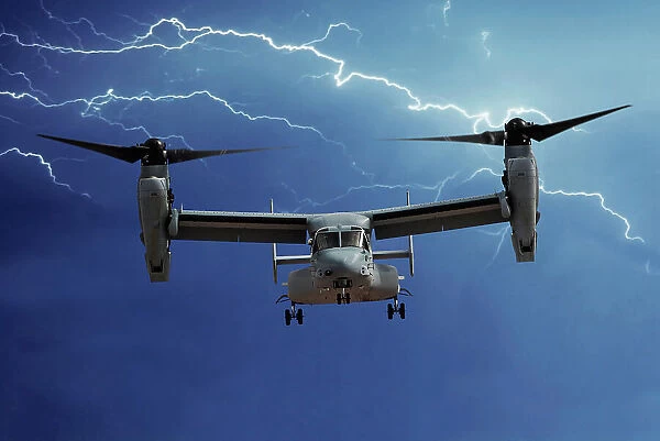 A head-on view of a U. S. Marine Corps Bell / Boeing MV-22 Osprey tilt-rotor aircraft with lightning