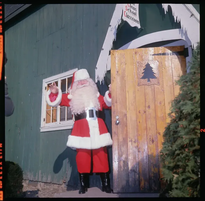 Framed Print : Headmaster of Santa Claus School Waving from Doorway Framed Print : Headmaster of Santa Claus School Waving from Doorway