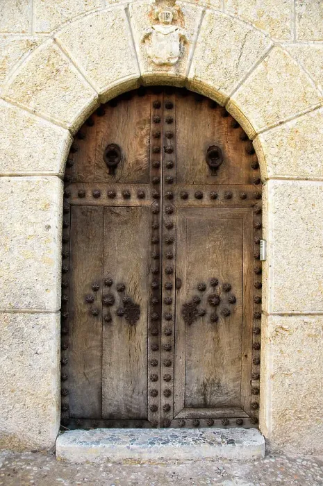 Framed Print : Heavy wooden doors at entrance of building