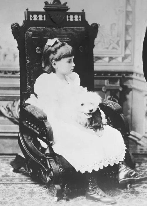 Framed Print : Helen Keller Holding Pet Poodle in Chair Framed Print : Helen Keller Holding Pet Poodle in Chair