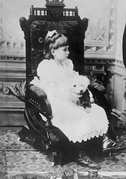 Framed Print : Helen Keller Holding Pet Poodle in Chair Framed Print : Helen Keller Holding Pet Poodle in Chair