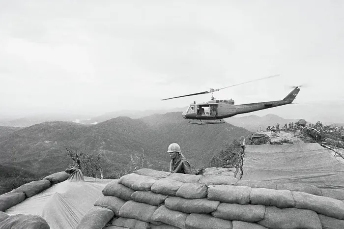 Framed Print : Helicopter Hovering over Sandbags Framed Print : Helicopter Hovering over Sandbags