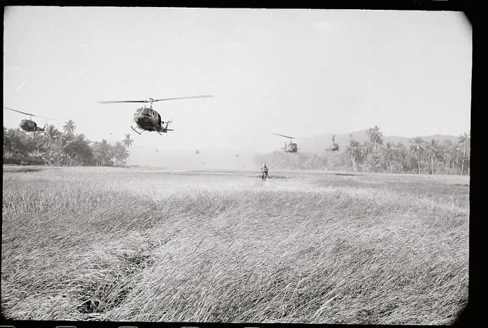 Framed Print : Helicopter Hovering over Soldier in Rice Field Framed Print : Helicopter Hovering over Soldier in Rice Field
