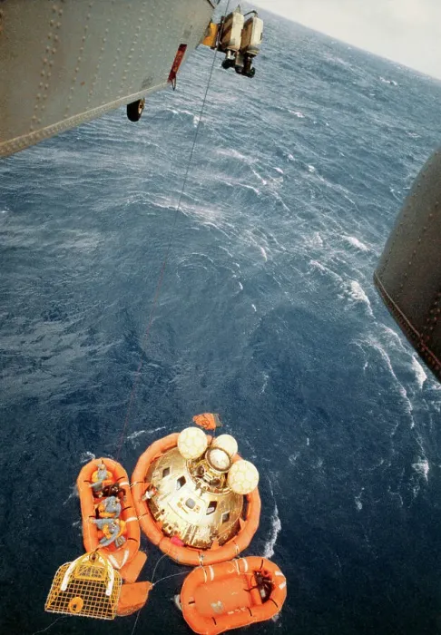 Framed Print : Helicopter Lowering Rescue Net to Astronauts