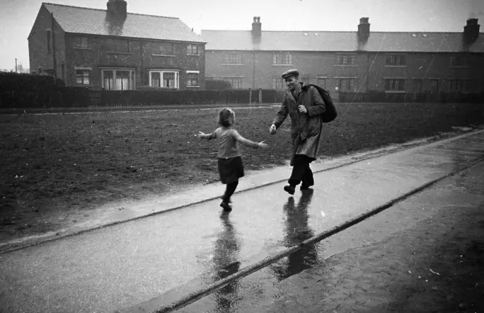 Framed Print : Hello Dad. 21st March 1942: A little girl runs to meet her father on his return from work Framed Print : Hello Dad. 21st March 1942: A little girl runs to meet her father on his return from work