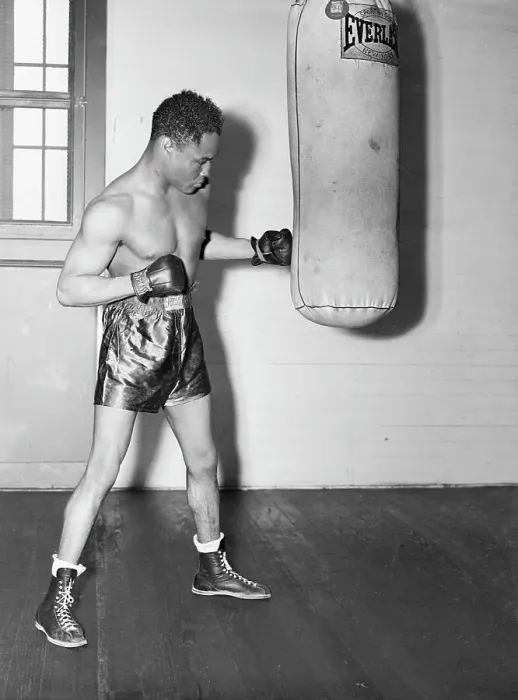 Framed Print : Henry Armstrong Hitting Heavy Bag