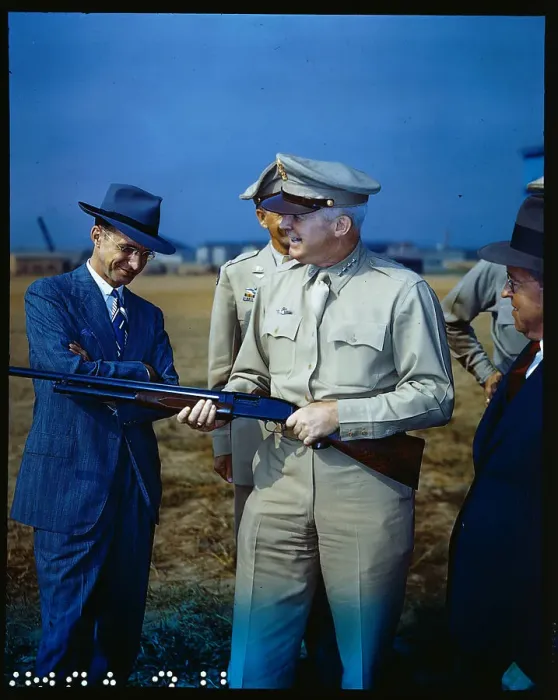 Framed Print : Henry H. Wilson Examining Rifle