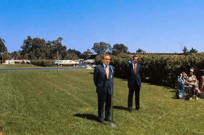 Framed Print : Henry Kissinger Speaking at Microphone on Lawn Framed Print : Henry Kissinger Speaking at Microphone on Lawn