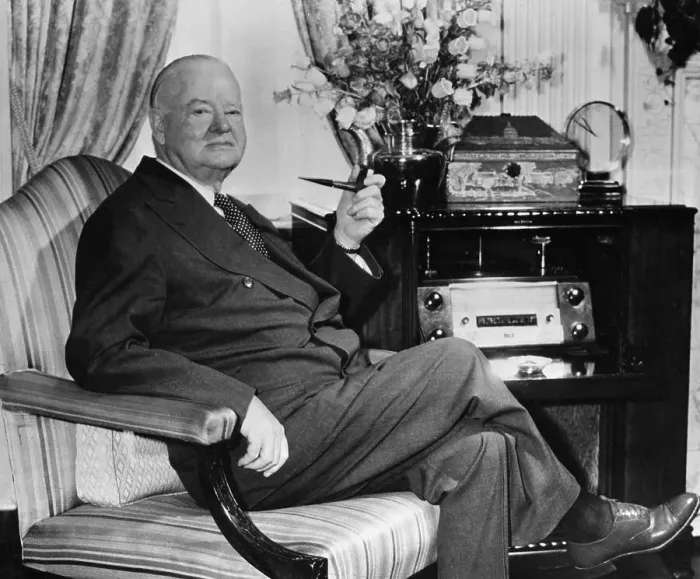 Framed Print : Herbert Hoover Seated in Chair with Pipe in Hand Framed Print : Herbert Hoover Seated in Chair with Pipe in Hand