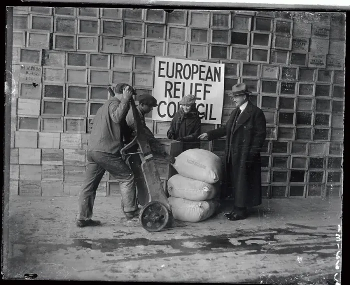 Framed Print : Herbert Hoover Standing with Man Loading Bags of Food Framed Print : Herbert Hoover Standing with Man Loading Bags of Food