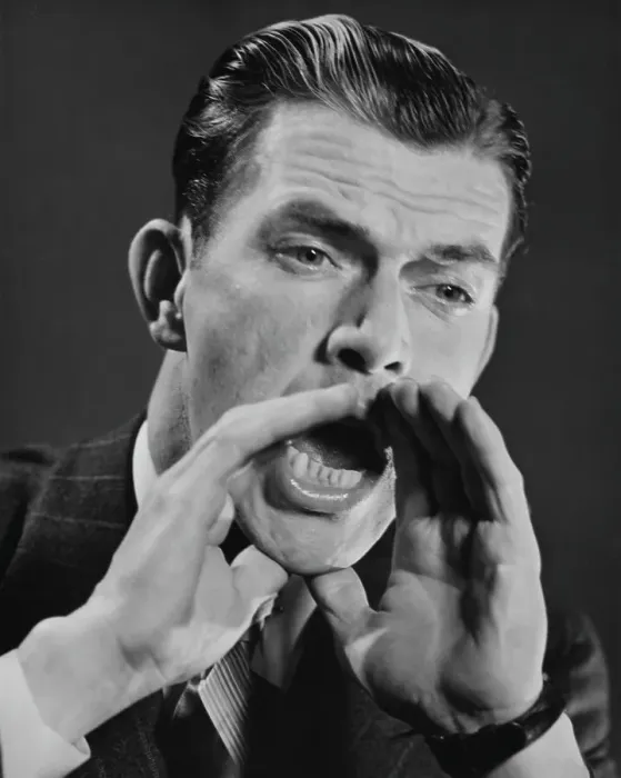 Framed Print : Hey There. A man cups his hands around his mouth to shout, circa 1950 Framed Print : Hey There. A man cups his hands around his mouth to shout, circa 1950