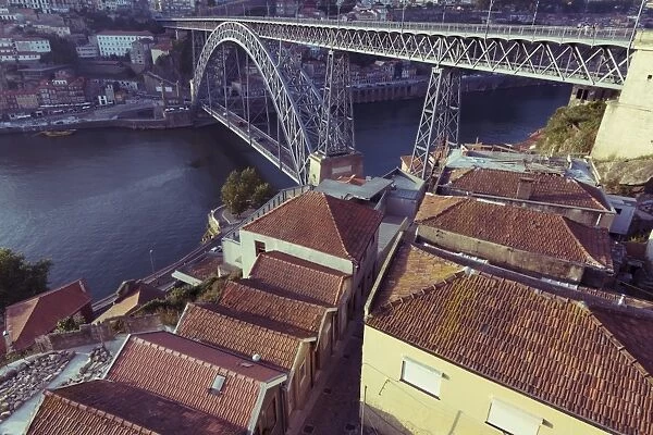 High view of ancient Ribera Distric of Porto and metallic Luis bridge