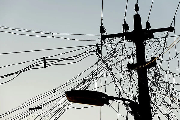 High voltage power line and tangled cables, Madurai, Tamil Nadu, India