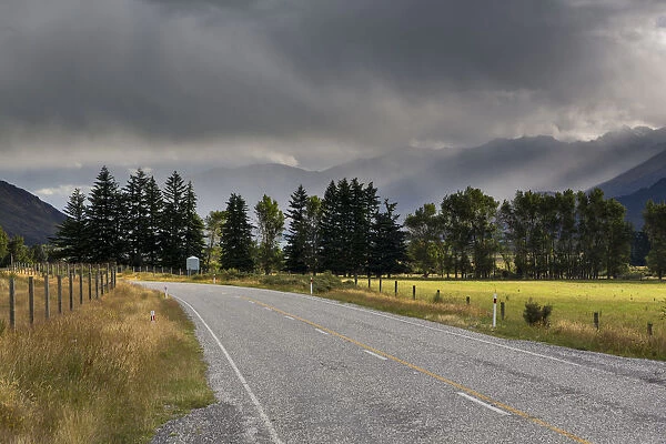 Highway, rain clouds above Lake Wanaka, Makarora, Otago Region, New Zealand