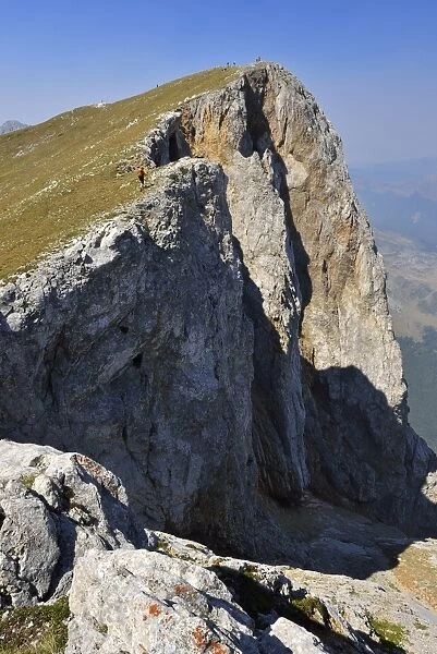 Hiker on the summit of Kom Vasojevicki Mountain, 2461 m, Komovi Mountains, Montenegro, Crna Gora, The Balkans, Europe