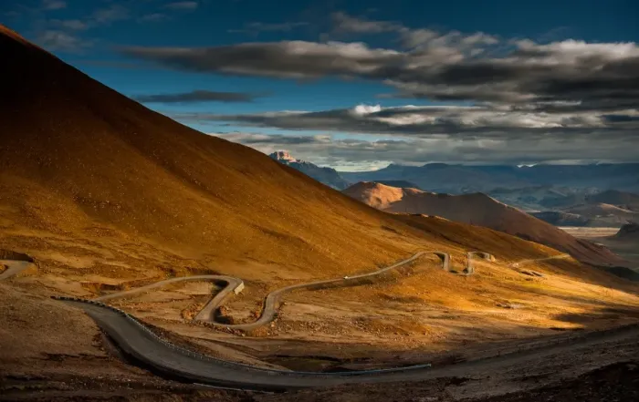 Framed Print : hill side meandering road on tibetan plateau