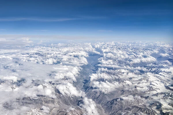Himalaya mountains under clouds. View from the airplane. India, Ladakh