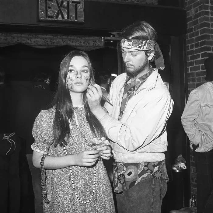 Framed Print : Hippie Woman Getting Her Face Painted Framed Print : Hippie Woman Getting Her Face Painted
