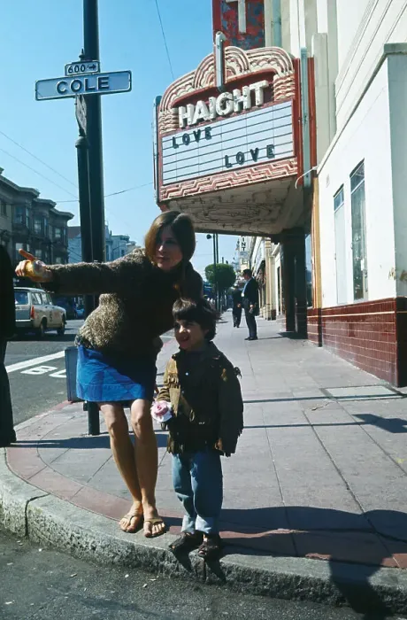 Framed Print : A Hippie and Young Boy Standing on a Street Corner Framed Print : A Hippie and Young Boy Standing on a Street Corner