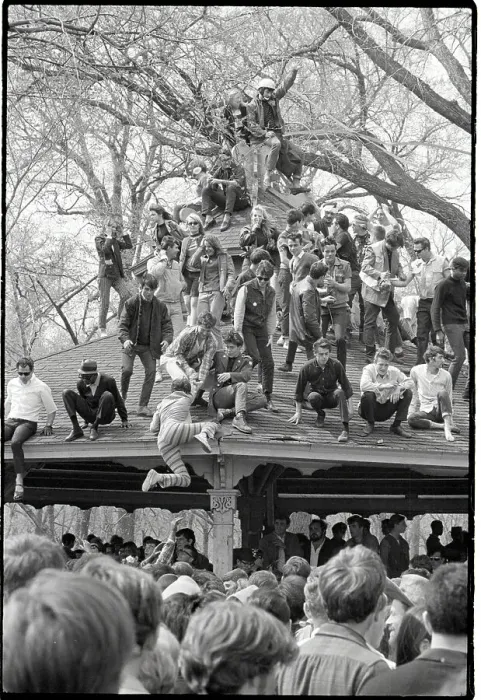 Framed Print : Hippies at Love-In Climb on a Roof