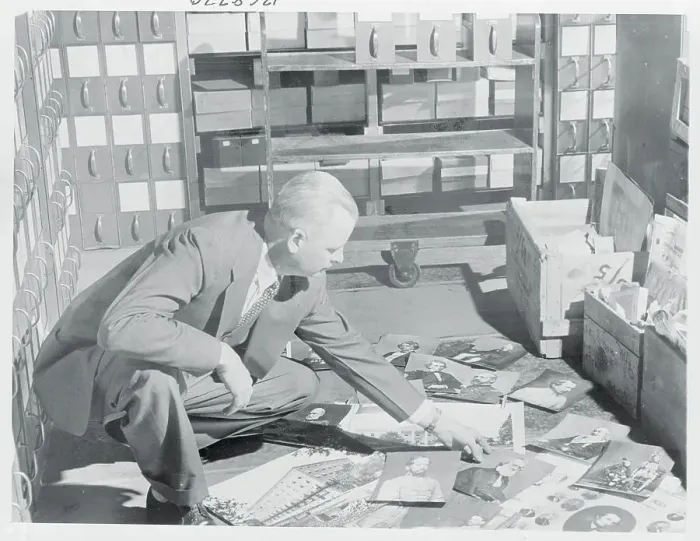 Framed Print : Hirst Milhollen Sorting Photographs