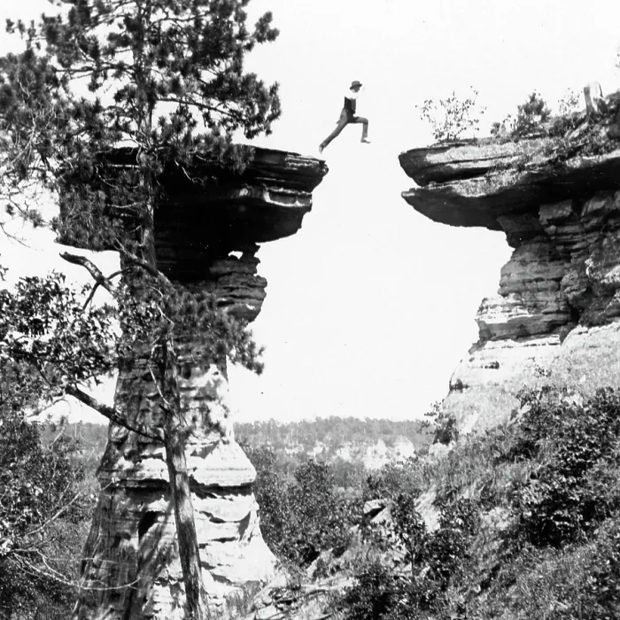 Framed Print : Historic photograph of man leaping between boulder in mid-air Framed Print : Historic photograph of man leaping between boulder in mid-air