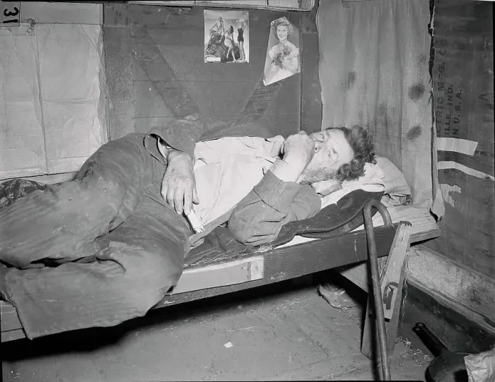 Framed Print : Hobo Lying on His Cot Framed Print : Hobo Lying on His Cot