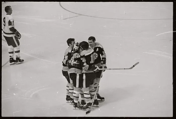 Framed Print : Hockey Players Embracing on Ice