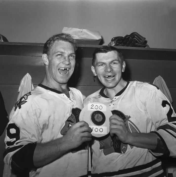 Framed Print : Hockey Players With Puck in Locker Room Framed Print : Hockey Players With Puck in Locker Room