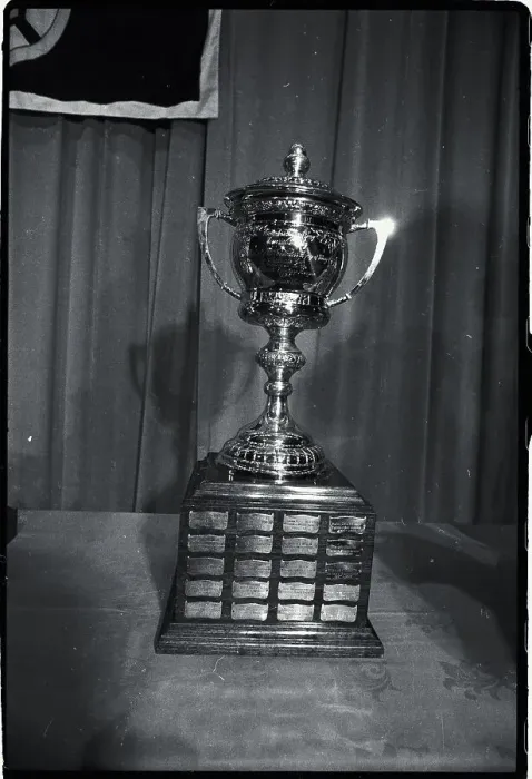 Framed Print : Hockey Trophy Standing on Table